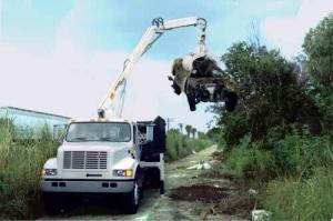 grapple loader illegal dump site